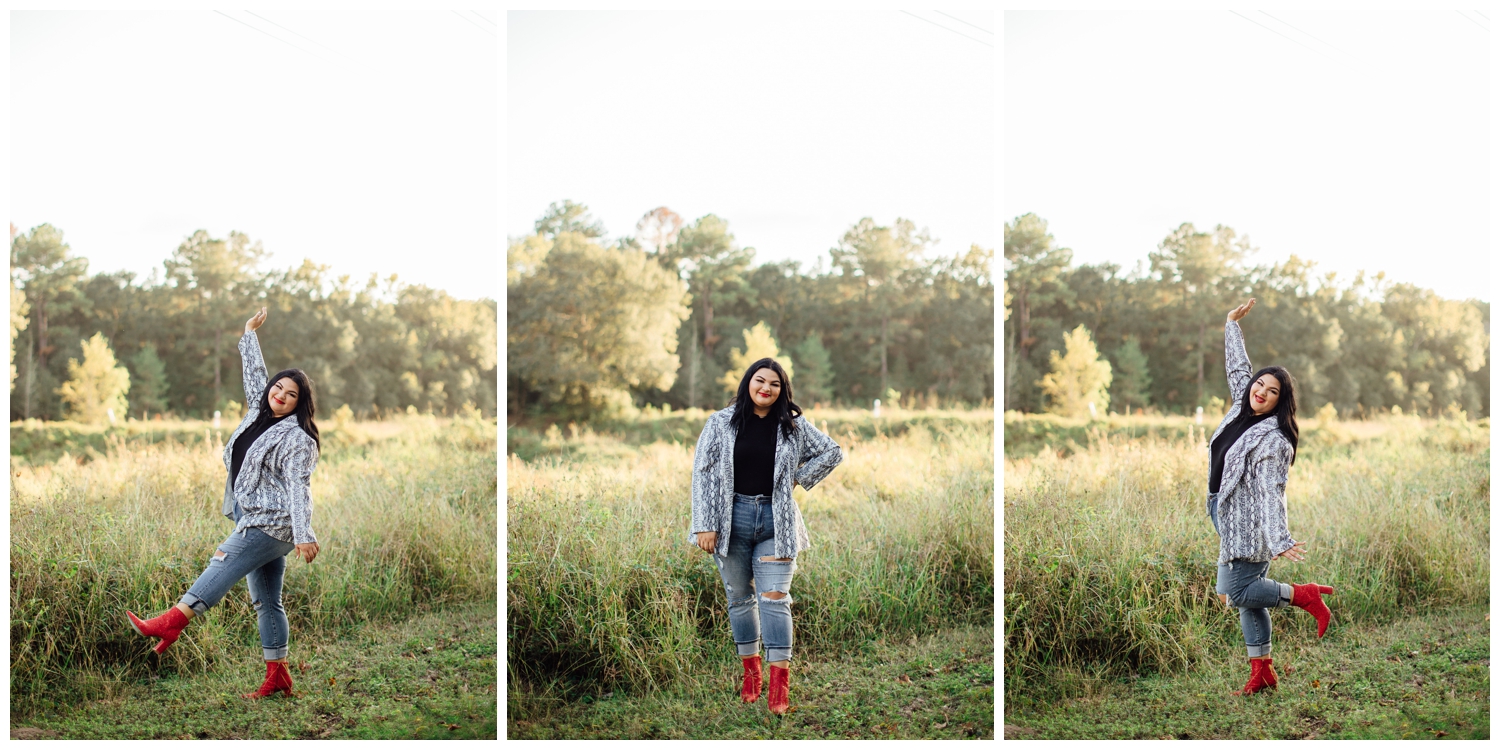 senior girl standing in field for for senior photographer in Cypress Texas wearing jeans and red sequins boots