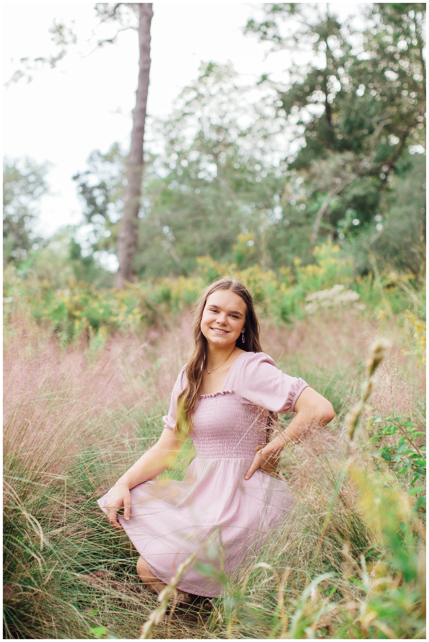 girl in pink dress kneeling in a field in Houston, Texas