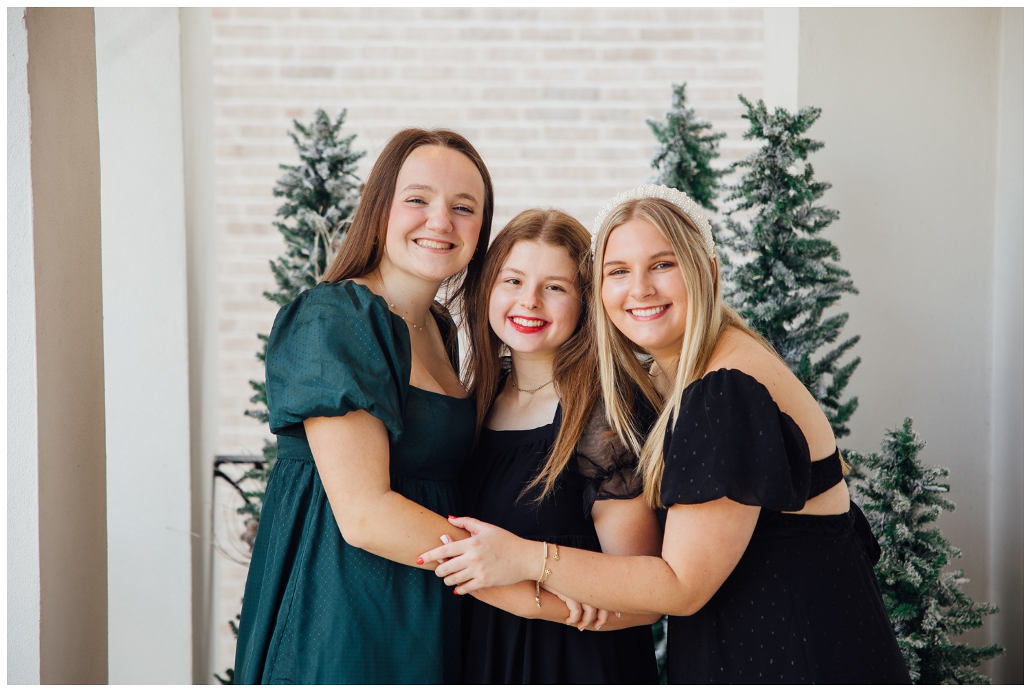 senior reps Christmas Photoshoot Houston with three girls hugging
