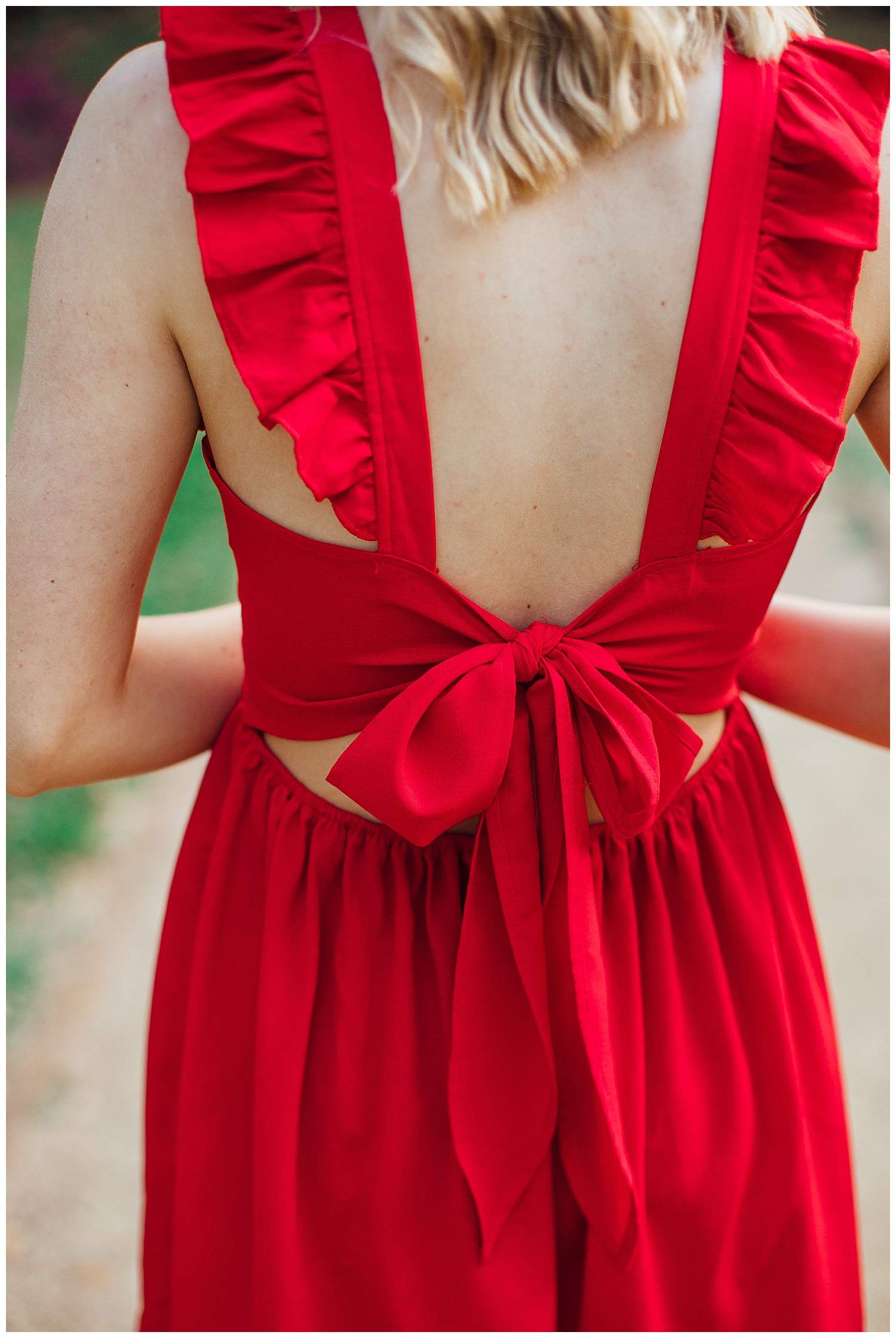 detailed image of back of red dress with a bow