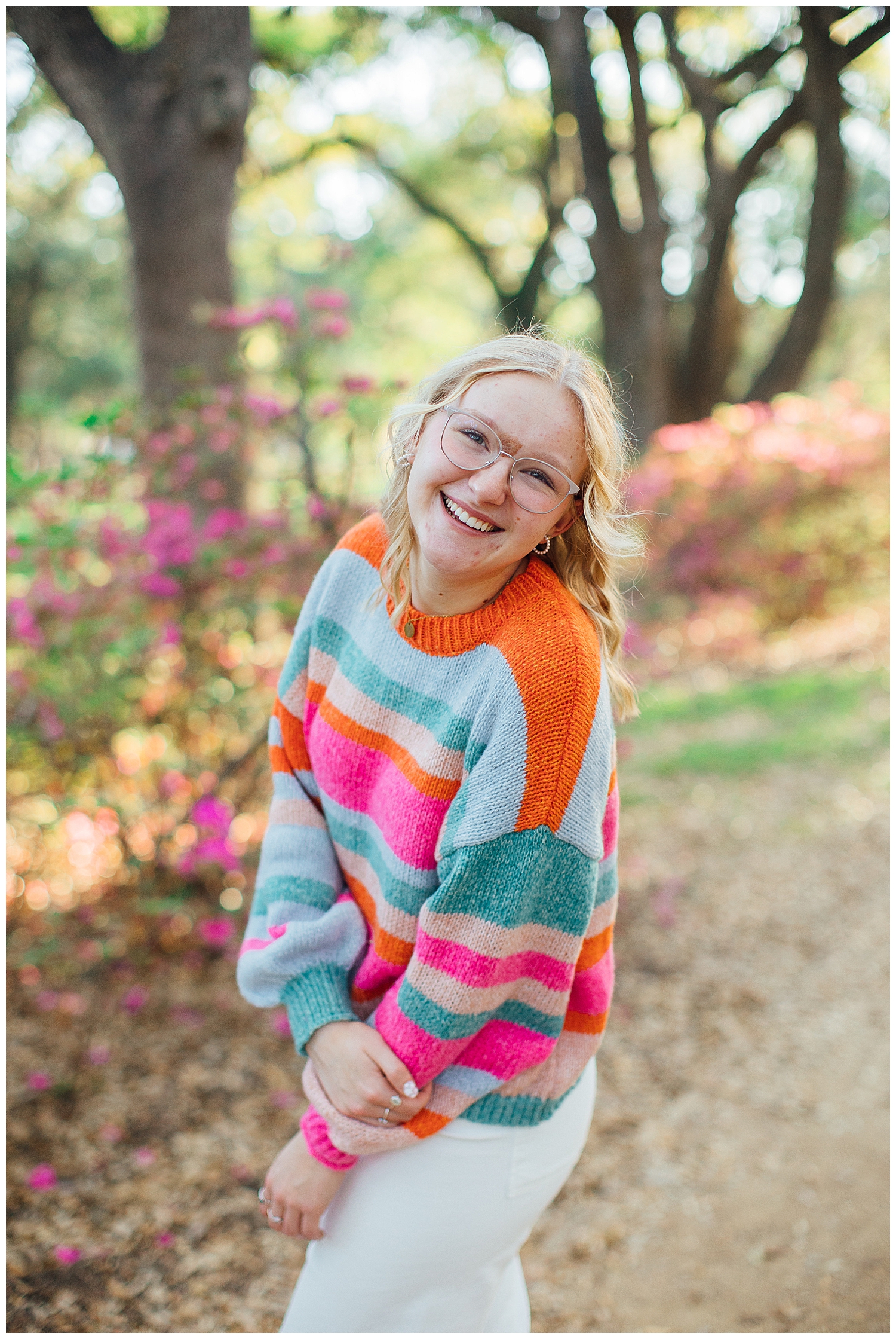colorful Houston senior session with girl in white jeans and sweater outdoors