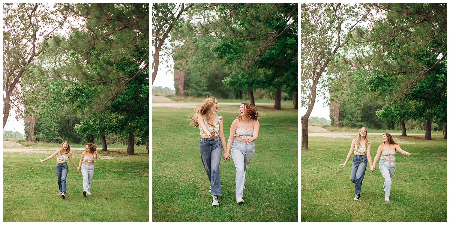 two senior girls in jeans running through a field at Cy Hope for best friends senior pictures