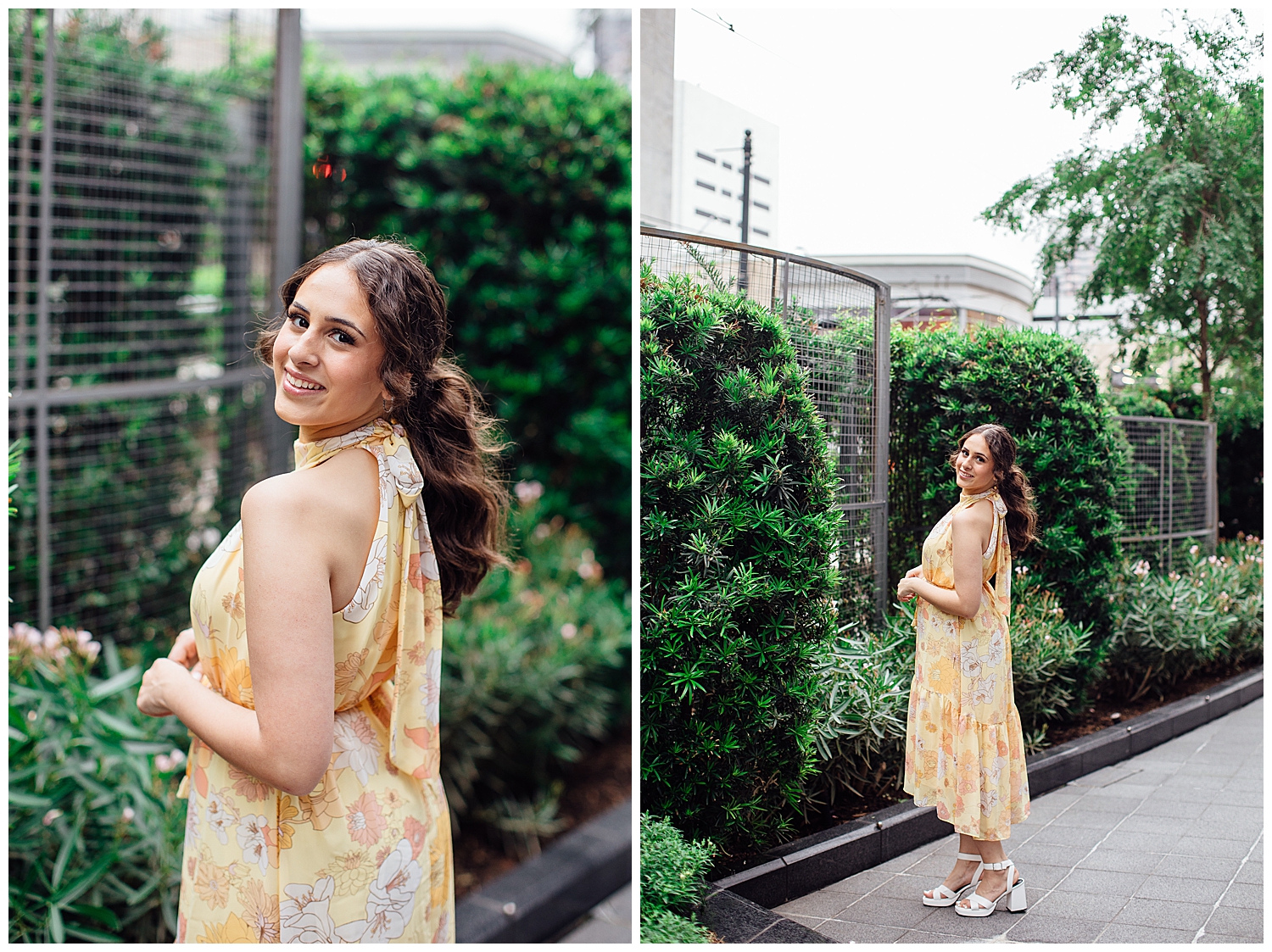high school senior girl in yellow floral dress standing on Main Street in front of greenery
