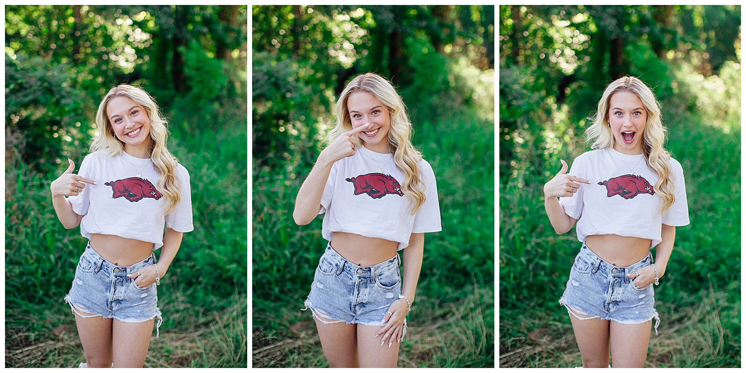 senior girl in white Arkansas college shirt with denim shorts and white boots outdoors Cy-Hope