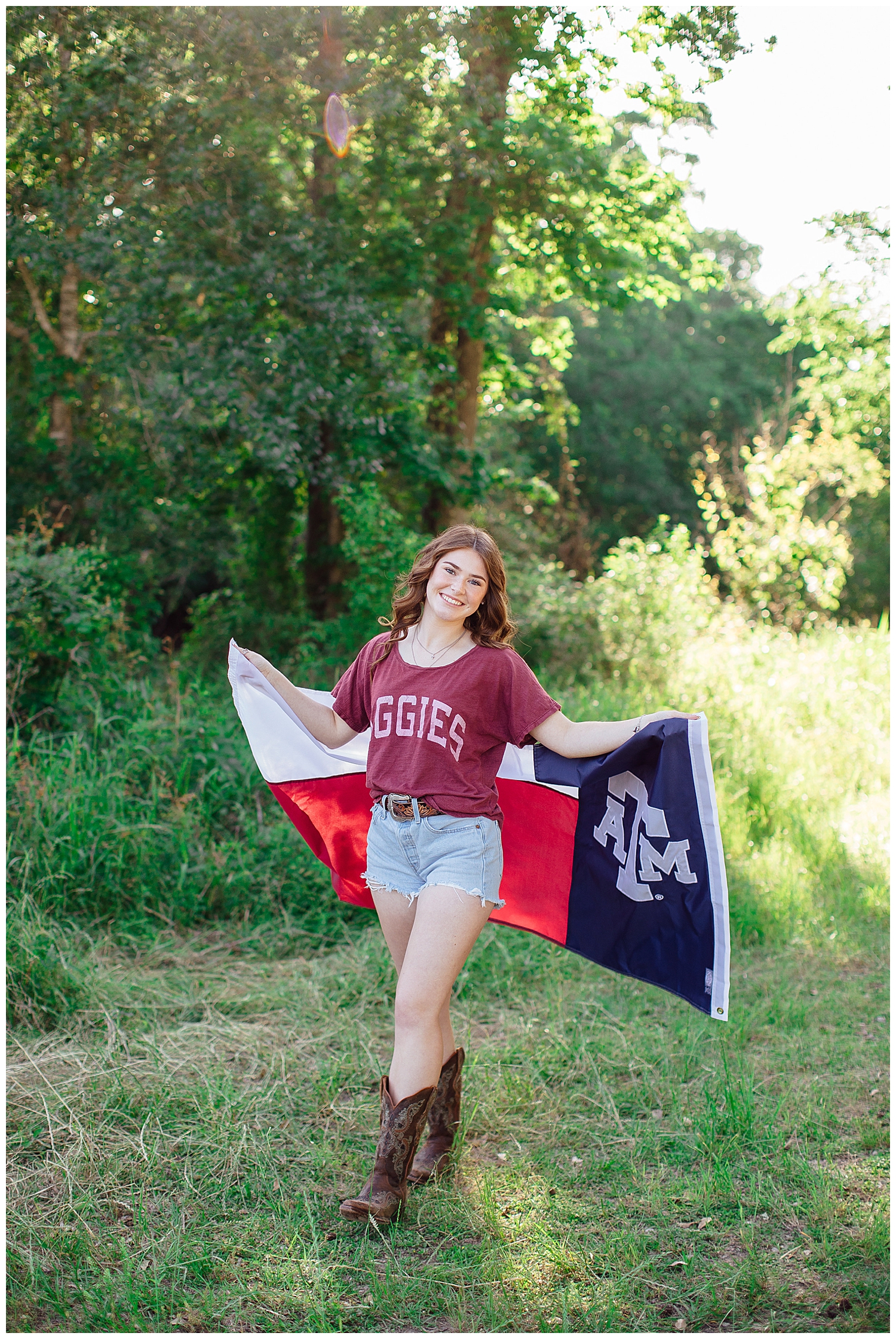 high school senior with Aggie flag wrapped around her for college shirt senior photos