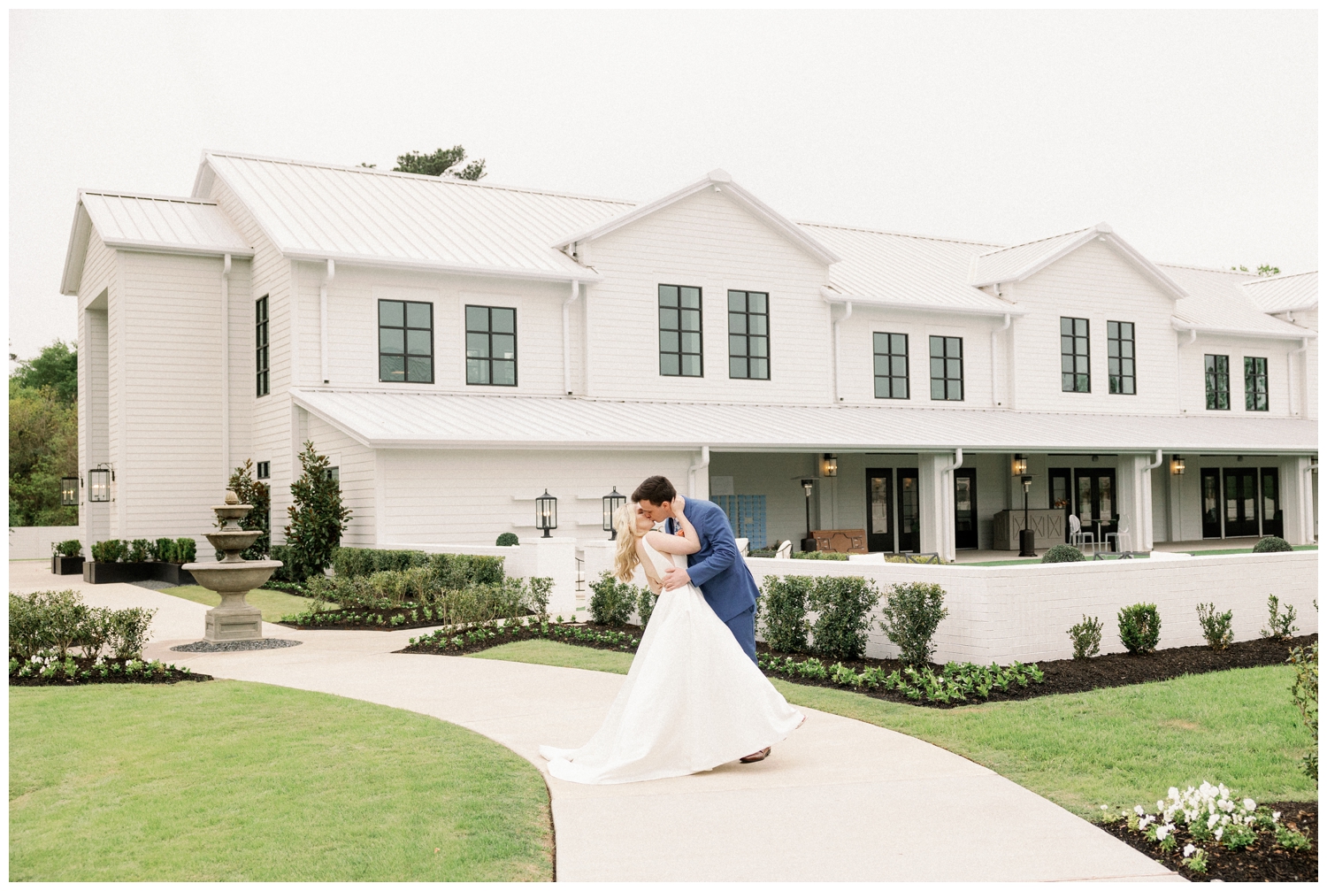 bride and groom kissing with a dip in front of Boxwood Manor Wedding venue