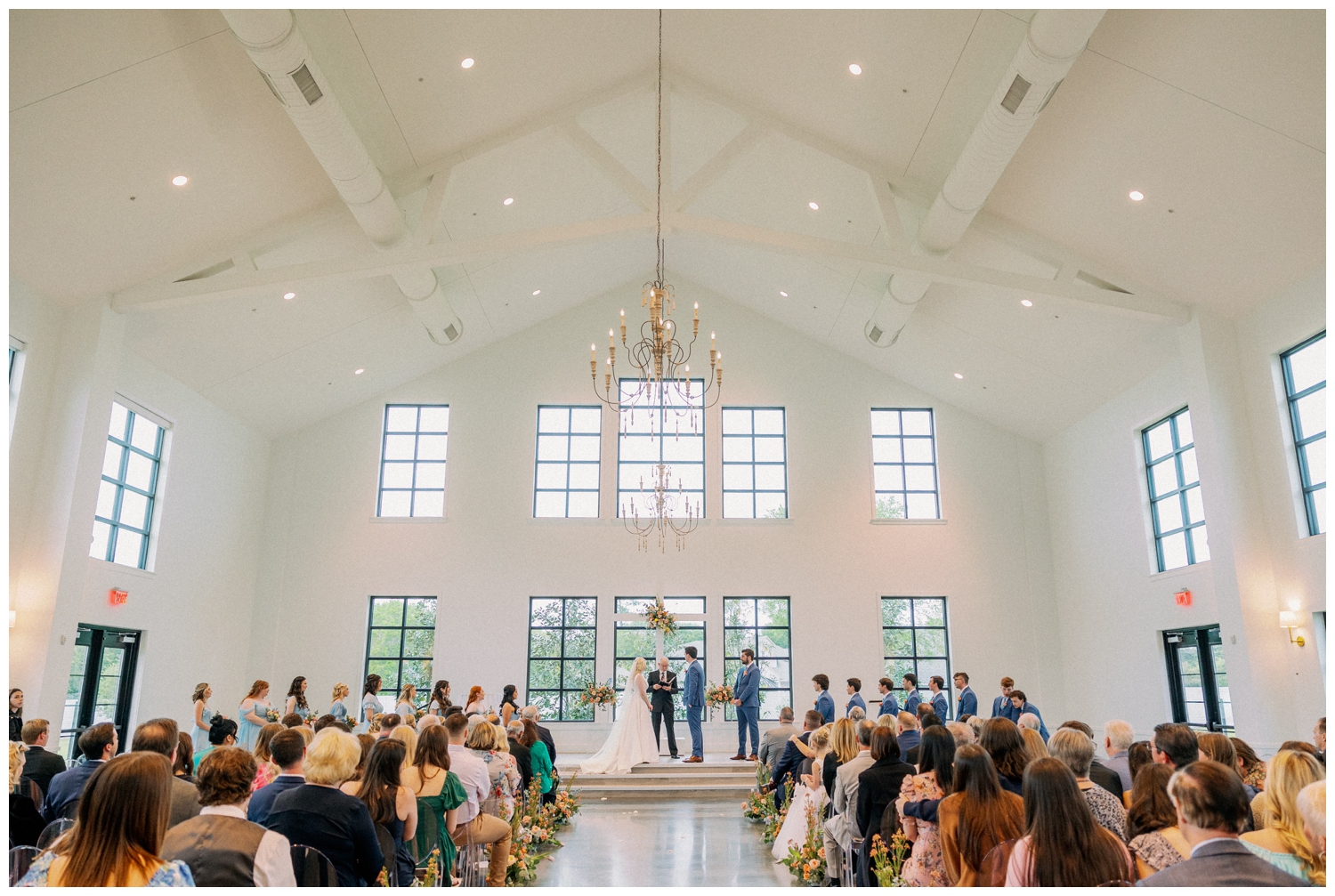 wedding ceremony with bride and groom at the altar inside Boxwood Manor Wedding venue chapel