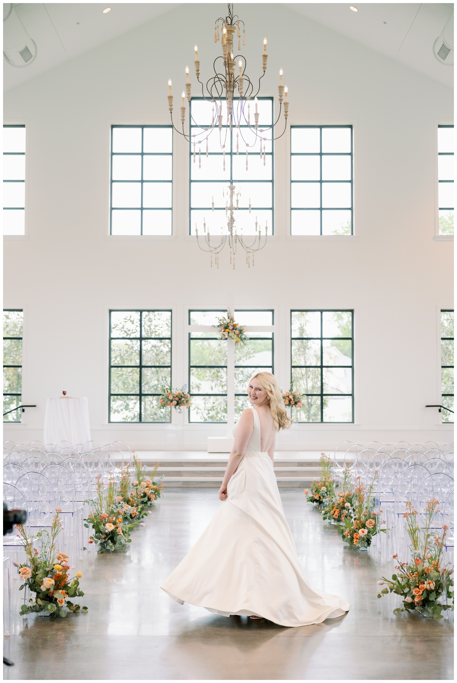 bridal twirling in wedding gown inside chapel at Boxwood Manor