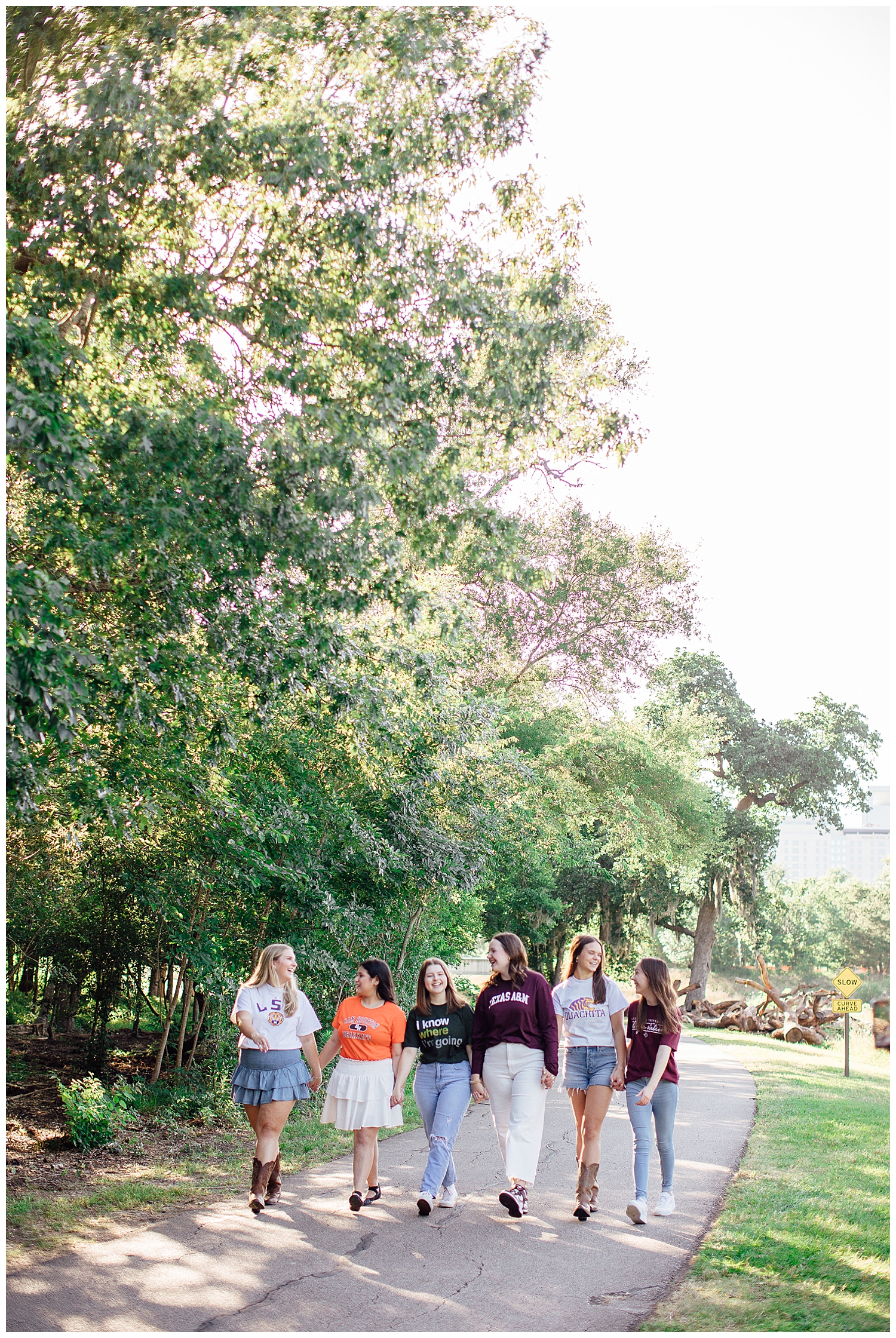 group of high school senior girls walking in houston texas park
