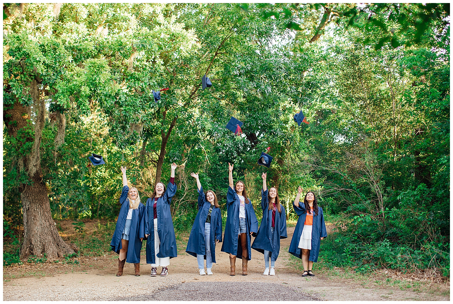 high school seniors in navy cap and gown for cap and gown senior pictures Houston, Texas