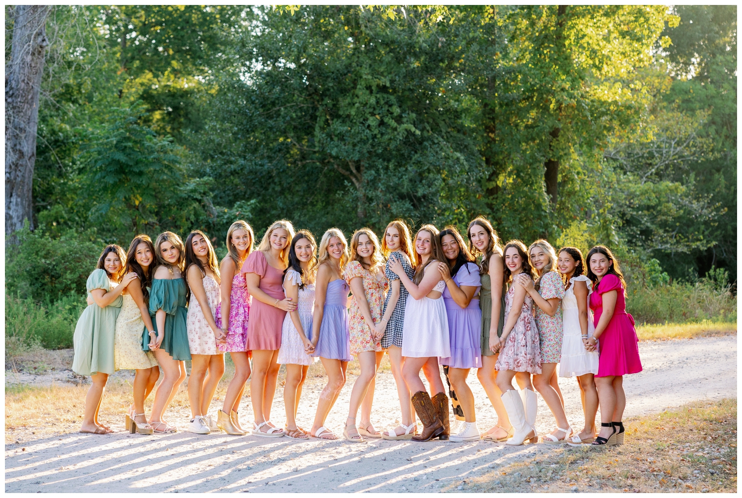 high school senior rep team Houston 17 girls in sundresses holding hands