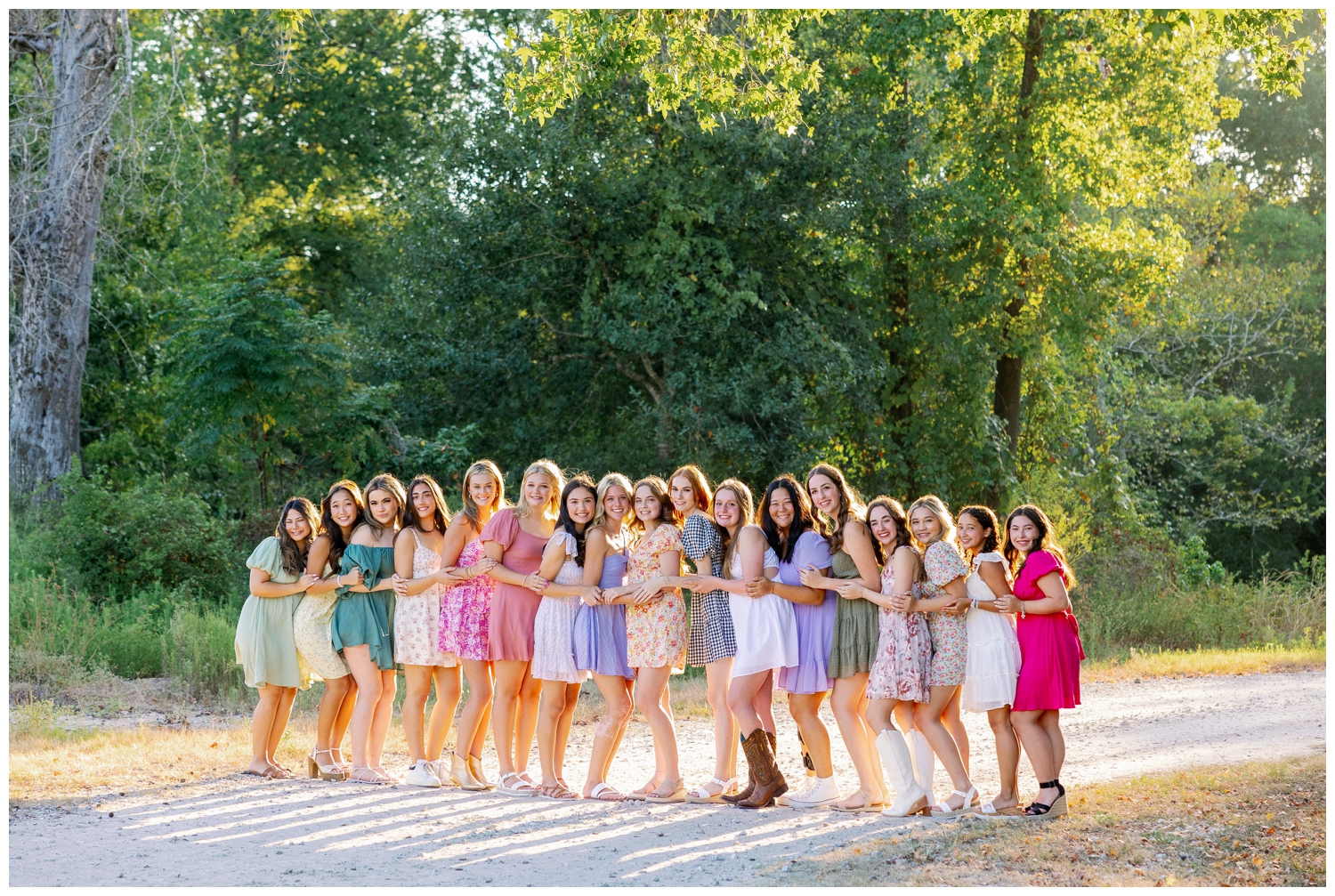 group of high school girls in sundresses outdoors for senior rep team Houston