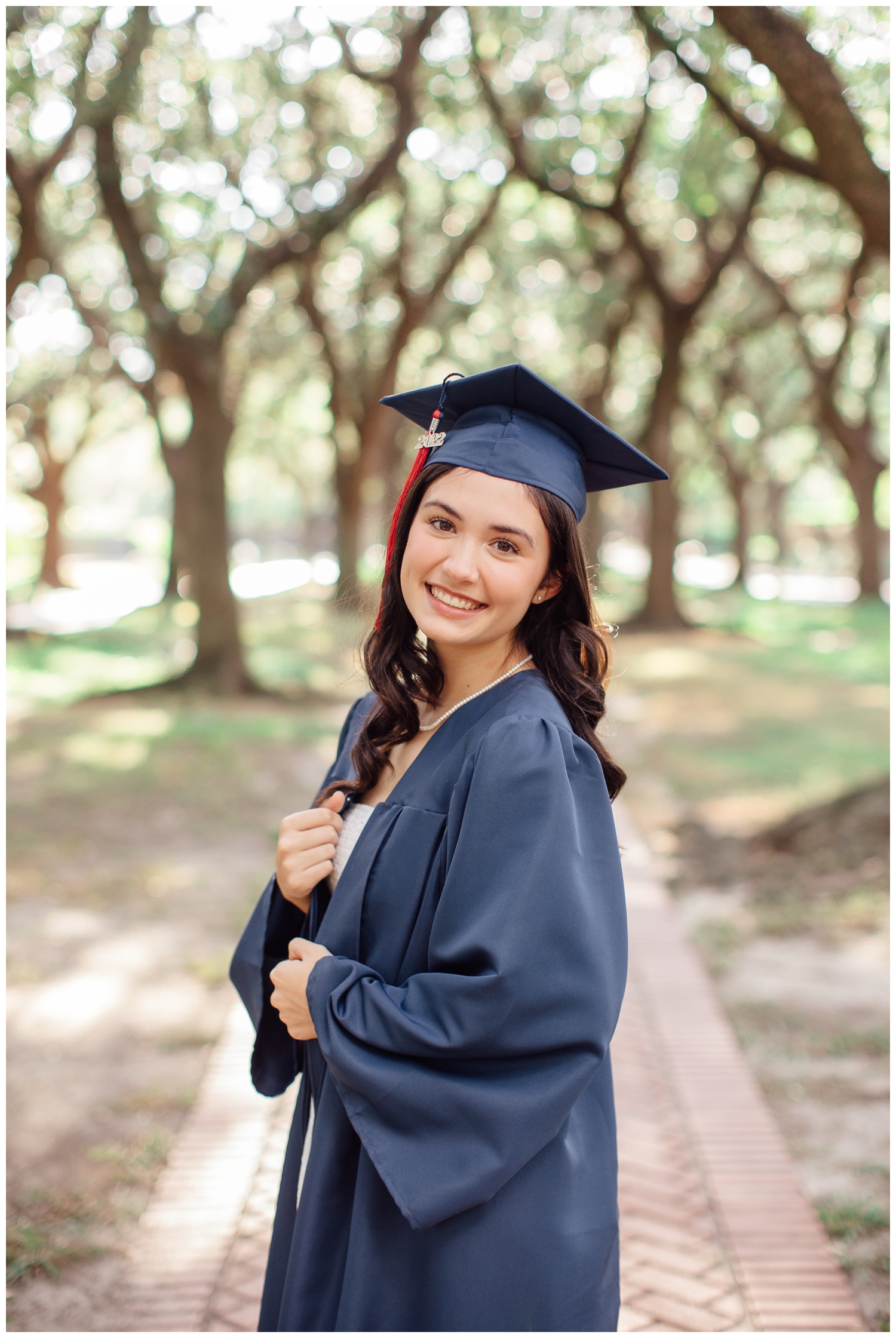 high school senior in graduation cap and gown senior photos Houston