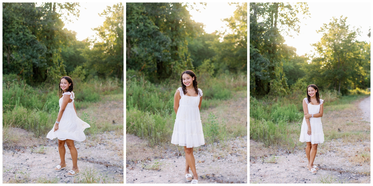 high school senior girl standing in a field in white sundress for senior rep team Houston