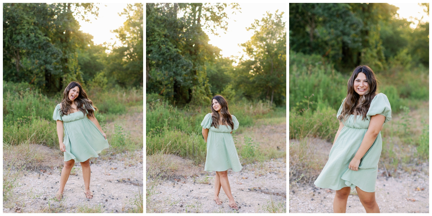 high school senior girl in sage green sundress smiling on outdoor pathway at Cy Hope