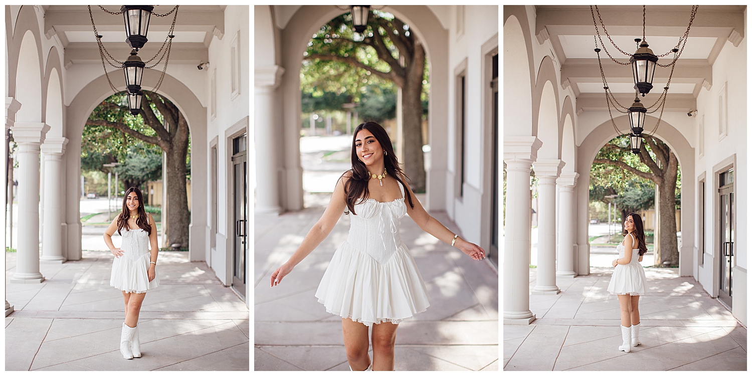 girl in white dress twirling under archway columns at Uptown Park senior photos Houston Texas