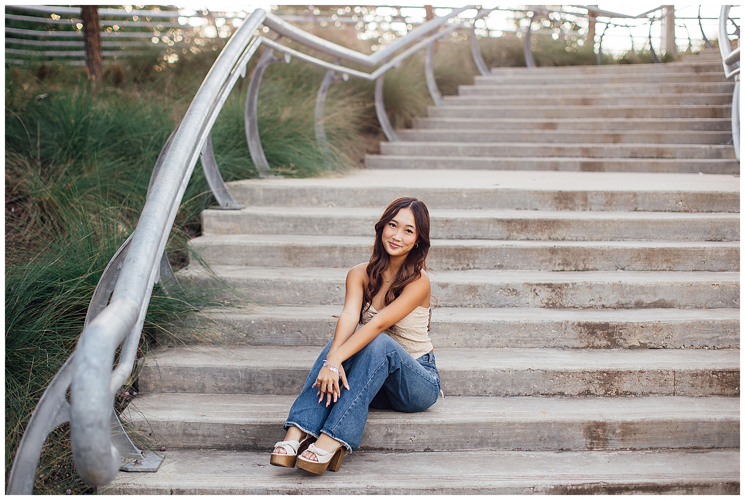 high school senior girl sitting on staircase sabine street park for fun senior pictures Houston downtown