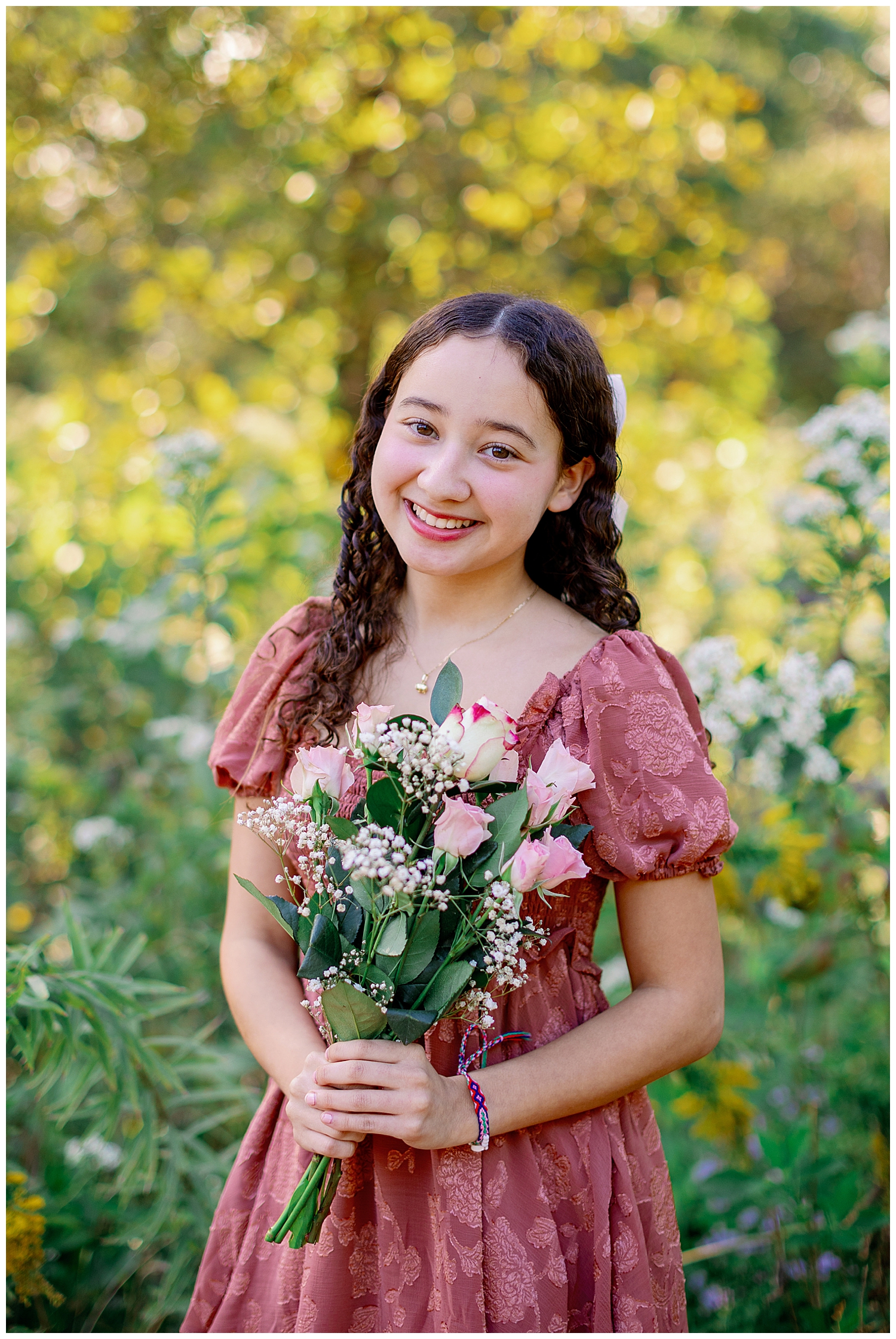 girl holding pink and white bouquet at Arboretum Houston senior pictures with flowers
