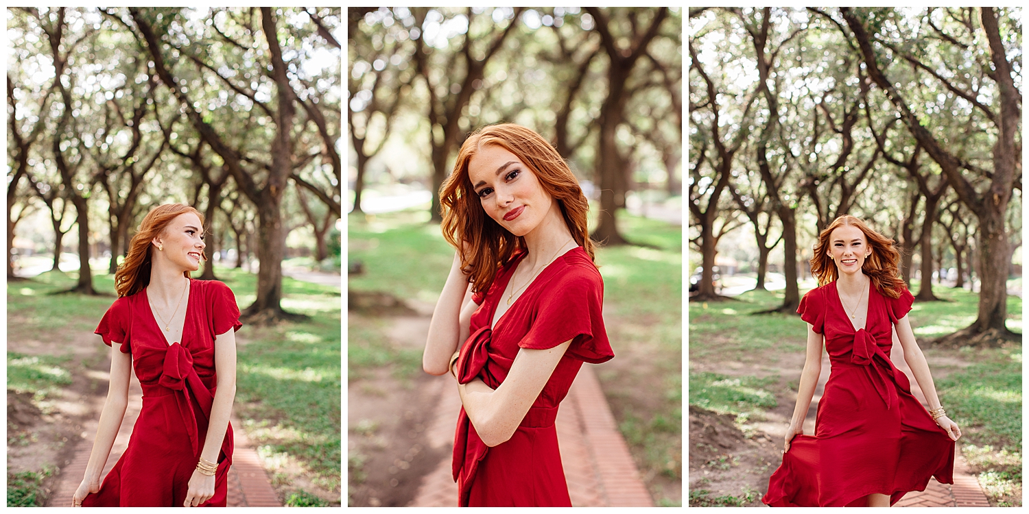 outdoor Houston senior pictures at North South Blvd tree line with girl standing in red dress