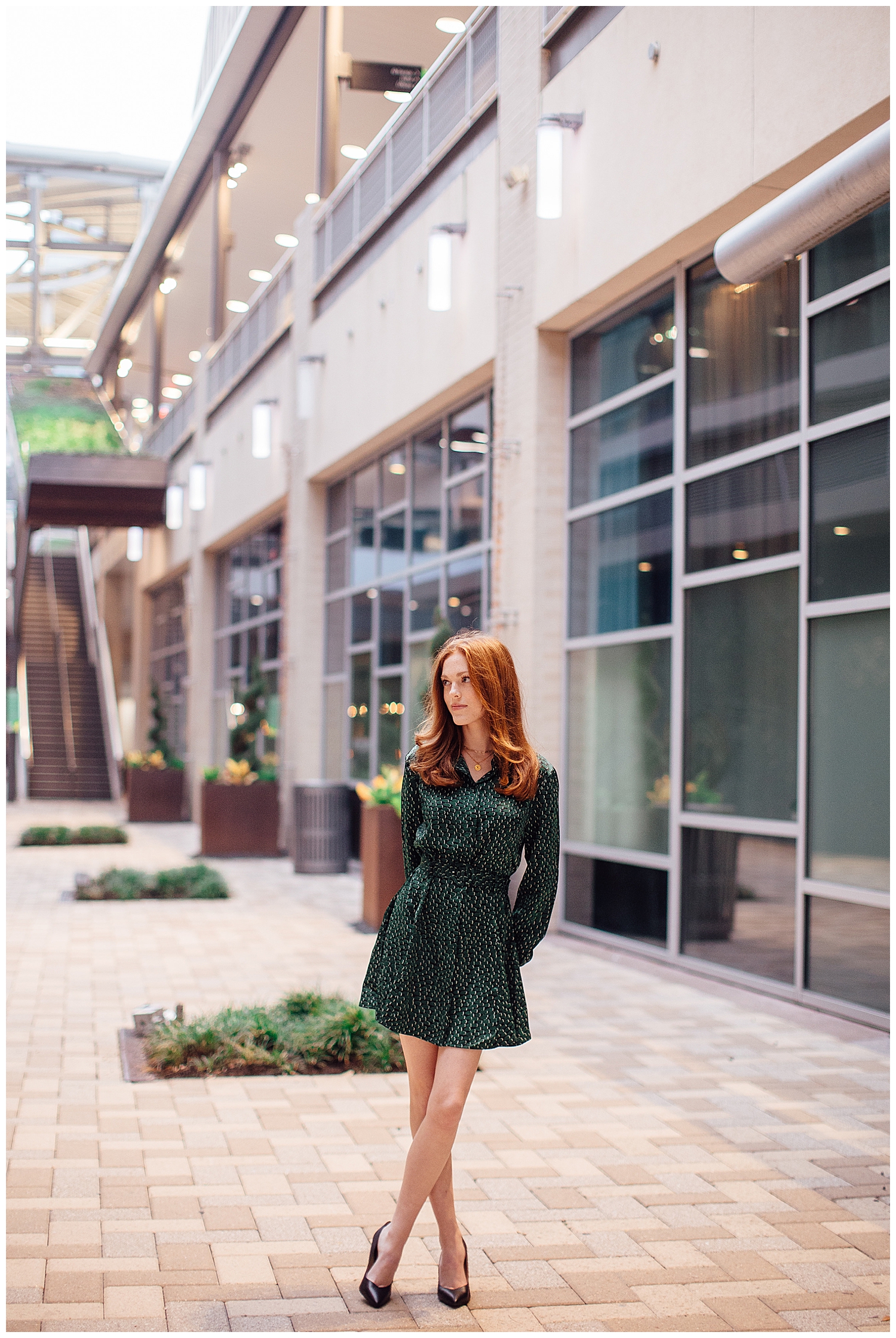 girl walking in downtown houston wearing green polkadot dress