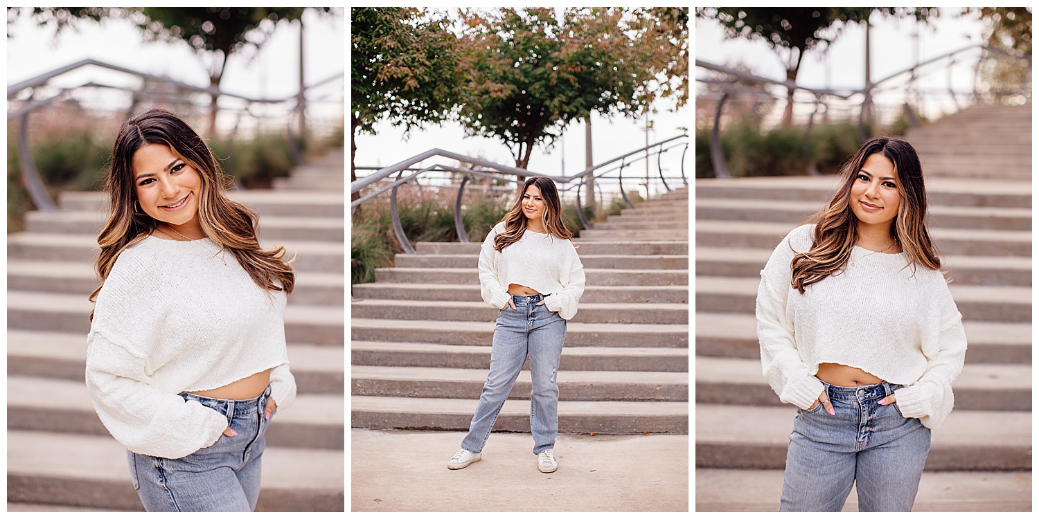 girl in jeans and white sweater standing on staircase downtown Houston senior photography sessions