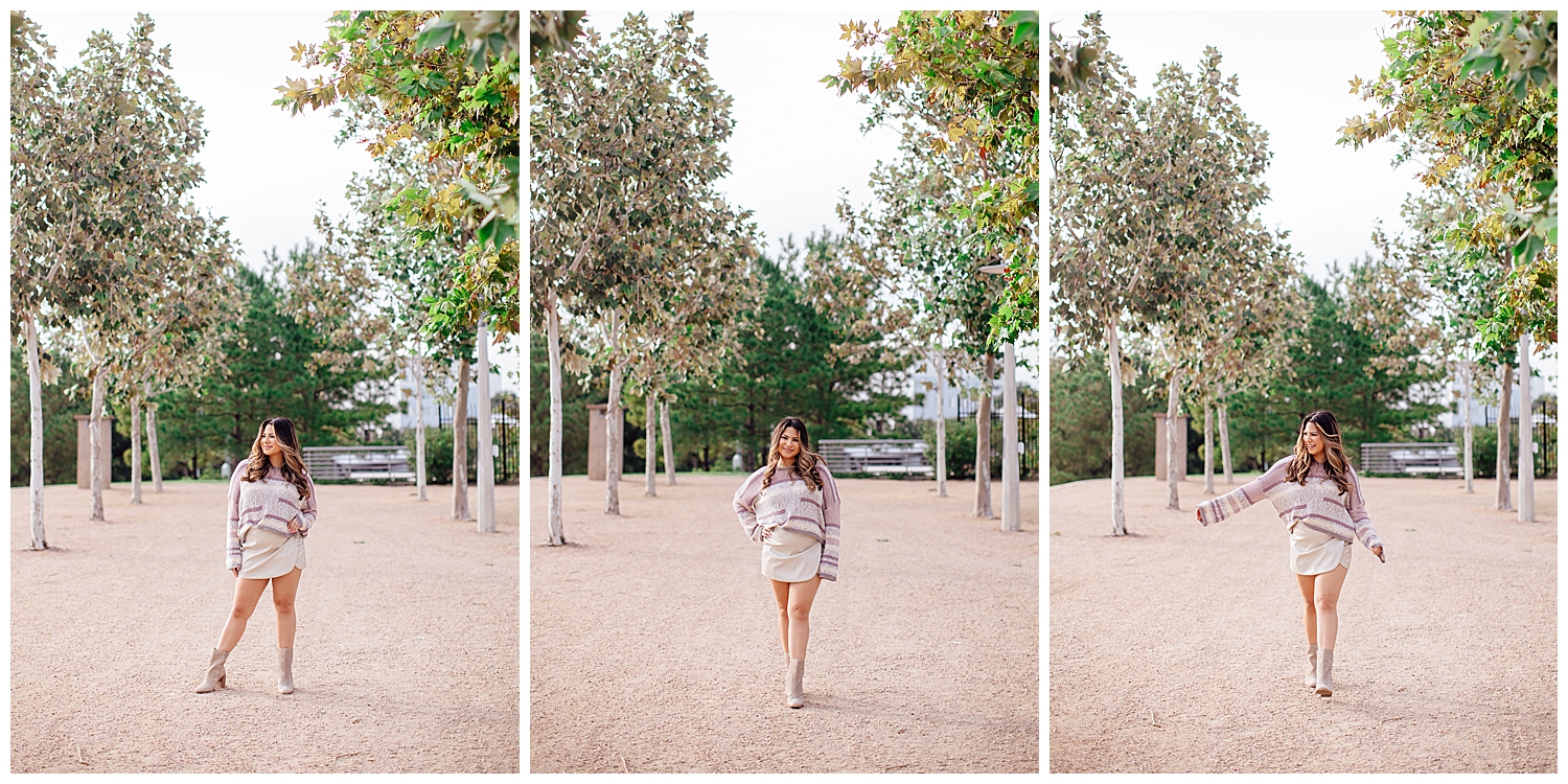 high school senior girl walking at Lee Jamal Skatepark between trees