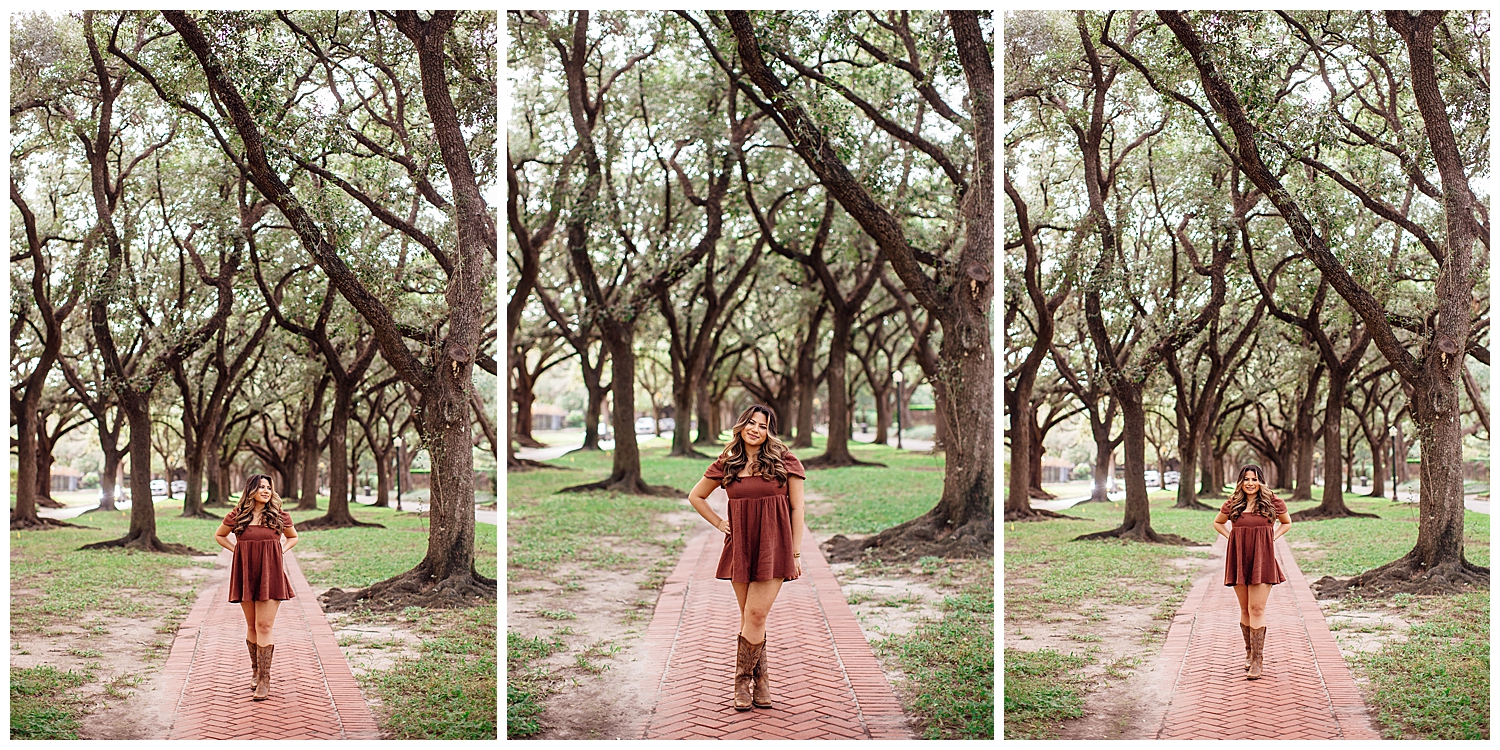 high school senior girl in brown dress with boots standing between trees for Houston senior photography session Museum District