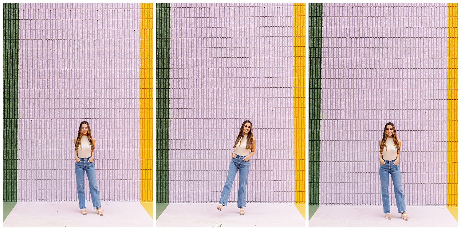 Sugar and Cloth Color Wall portraits of girl in denim jeans and beige top leaning against pink wall